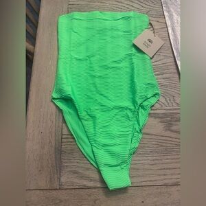 Toast Swim Tube one piece in neon palm wave.